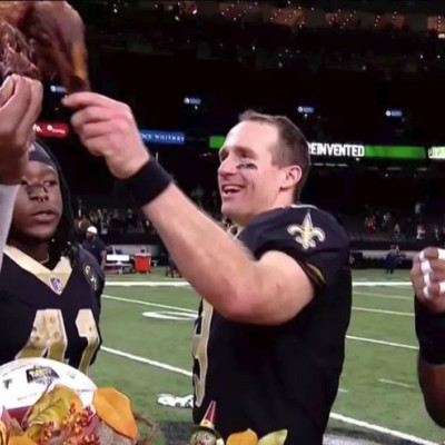 Drew Brees and the Saints toast a win over the Falcons with turkey legs